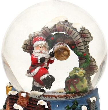 Деко-герої24 Снігова куля на хитромудро прикрашеній підставці, з музичним супроводом, мелодія Біле Різдво, Розміри L/B/H 12,5 x 12 x 14,5 см Сфера Ø 10 см (Санта-Клаус)