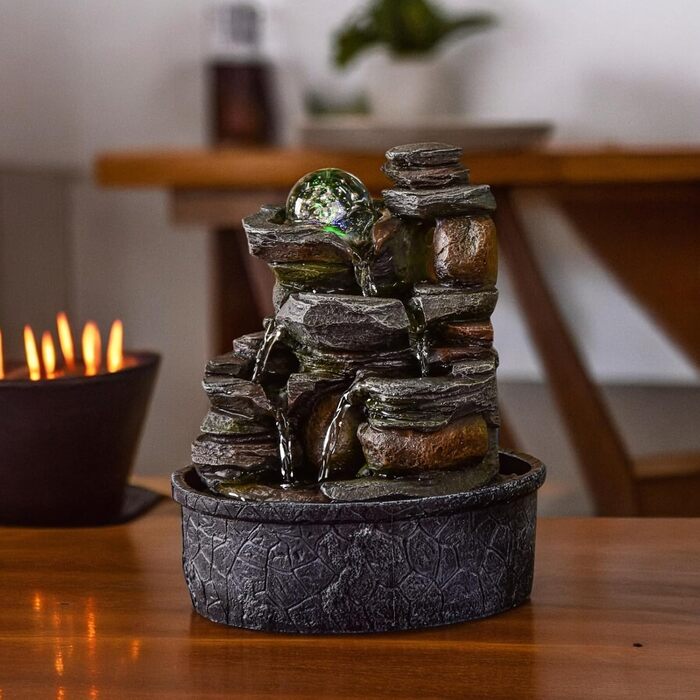 Джерело води Zen'Light від Zimmerbrunnen: природний водоспад з ефектом каменів та кольоровим LED-підсвічуванням. Ідеальна декор для дому, медитації та релаксації. Об'єкт Фен-Шуй для щастя. Висота 23 см (Satya)