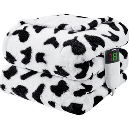 колір: чорно-біла корова