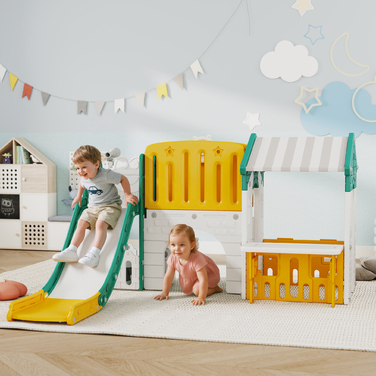 Дитячий ігровий комплекс AIYAPLAY 7-в-1: гірка, ігровий майданчик у приміщенні, лазілка, будиночок, дошка для малювання, баскетбольне кільце. Підходить для дітей 1-4 років, виготовлений з пластику, жовтого та зеленого кольорів.